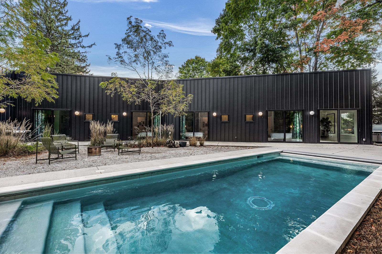 The home is a 10-minute walk from the local beach, and comes with a gunite pool in the backyard.