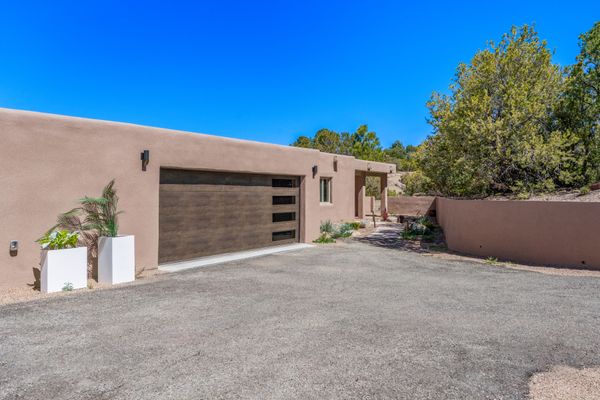 The adobe exterior conceals a contemporary interior with midcentury modern accents.