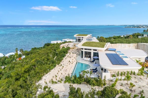 This $3.5M island getaway comes with 180-degree ocean views, a large oculus, and a curvaceous infinity pool.
