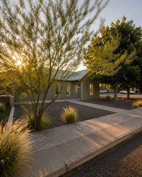 Designer Barbara Hill turned the century-old adobe home into a restrained retreat with steel beams, plaster walls, and a garden oasis.