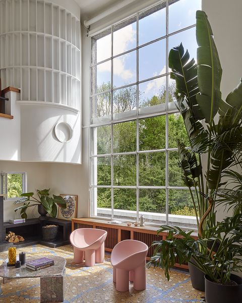 The renovation preserved and restored many of the original Art Deco elements, including the sculptural fireplace, terrazzo tile, and the geometric woodwork crowning the staircase.