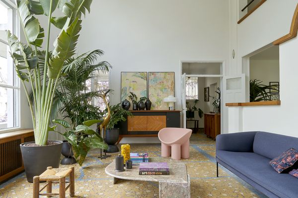 One of the most memorable interior spaces is the double-height living room, flanked on one side by tall windows.