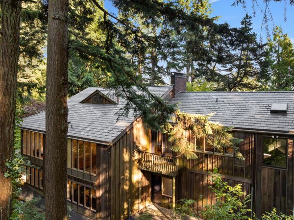 Set on 3.95 acres, the home is surrounded by the Sylvan Highlands, and in close proximity to the Hoyt Arboretum.