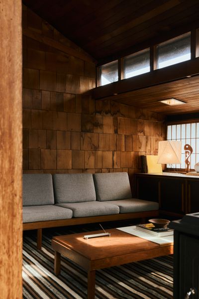 A 1950s modular sofa by Martin Borenstein anchors the living, accented by Studio Tenjung's LIWU yak wool rug.