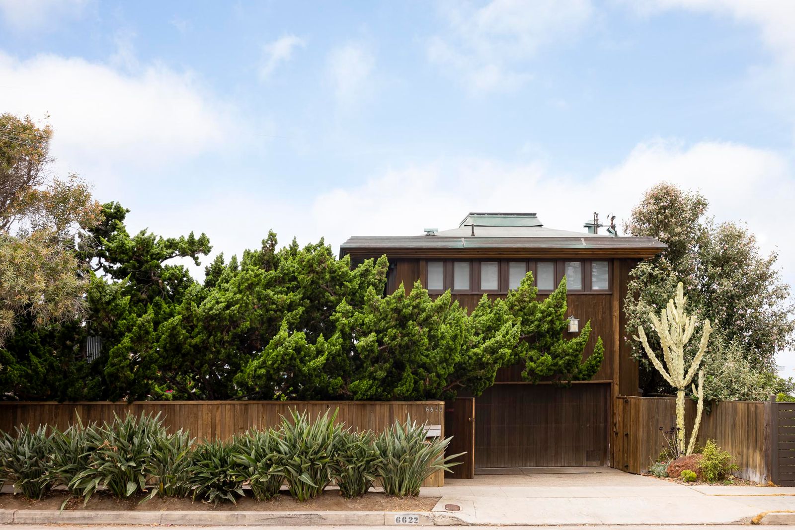 This La Jolla home was built in the 1940s and later revamped by famed architect Kendrick Bangs Kellogg with striking wood details and concrete forms.