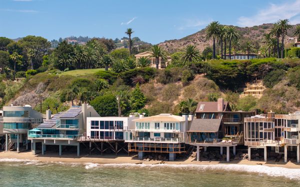 Located on the Malibu coastline, the home boasts direct beach access.