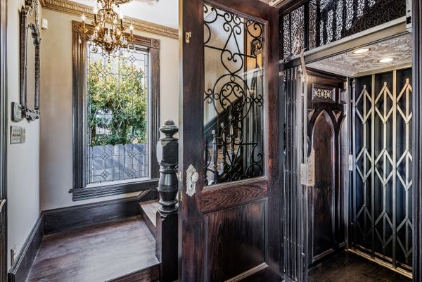 The home is illuminated by more than 30 chandeliers and custom sconces.