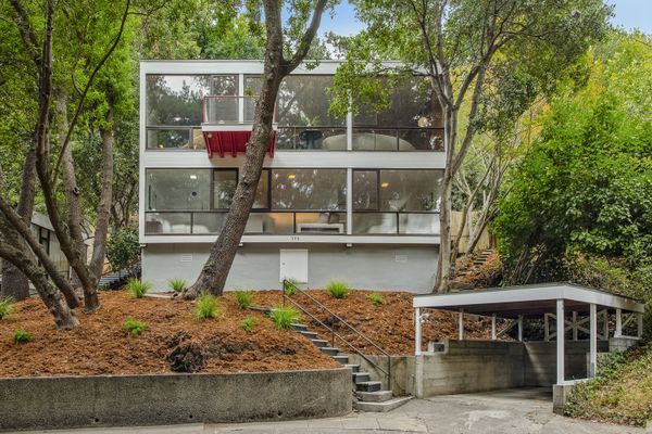 Architect Donald Olsen drew inspiration from the Bauhaus as he designed this clean-lined midcentury set on a wooded Berkeley hillside.