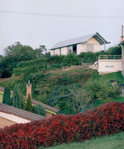Casa Guadalupe is a 1,290-square-foot prefabricated home designed for a couple living in Gijón, Spain.