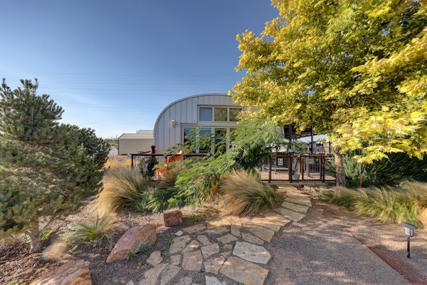 A Quonset hut structure with an office and carport can operate as the primary home for the future owner.