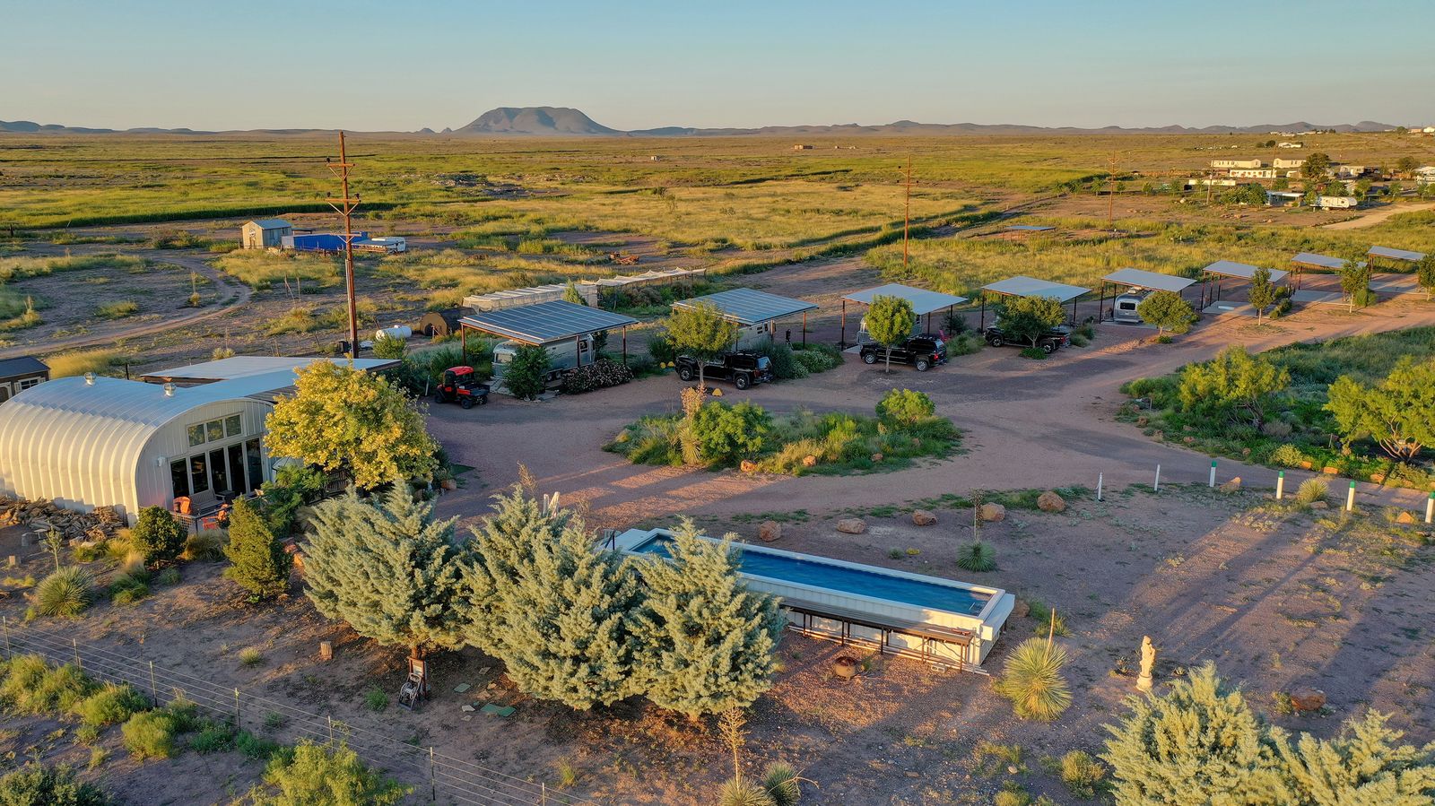 Located on the eastern edge of town, the property comes with a steely home, a shipping container pool, and 19 camper hookups.
