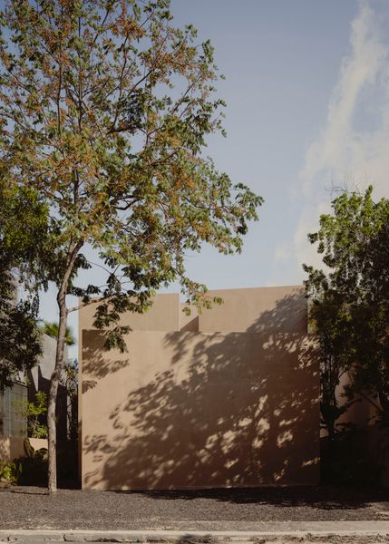 The monolithic home by Erentia Arquitectos pairs cavernous interiors with perfectly placed skylights and pocket gardens.