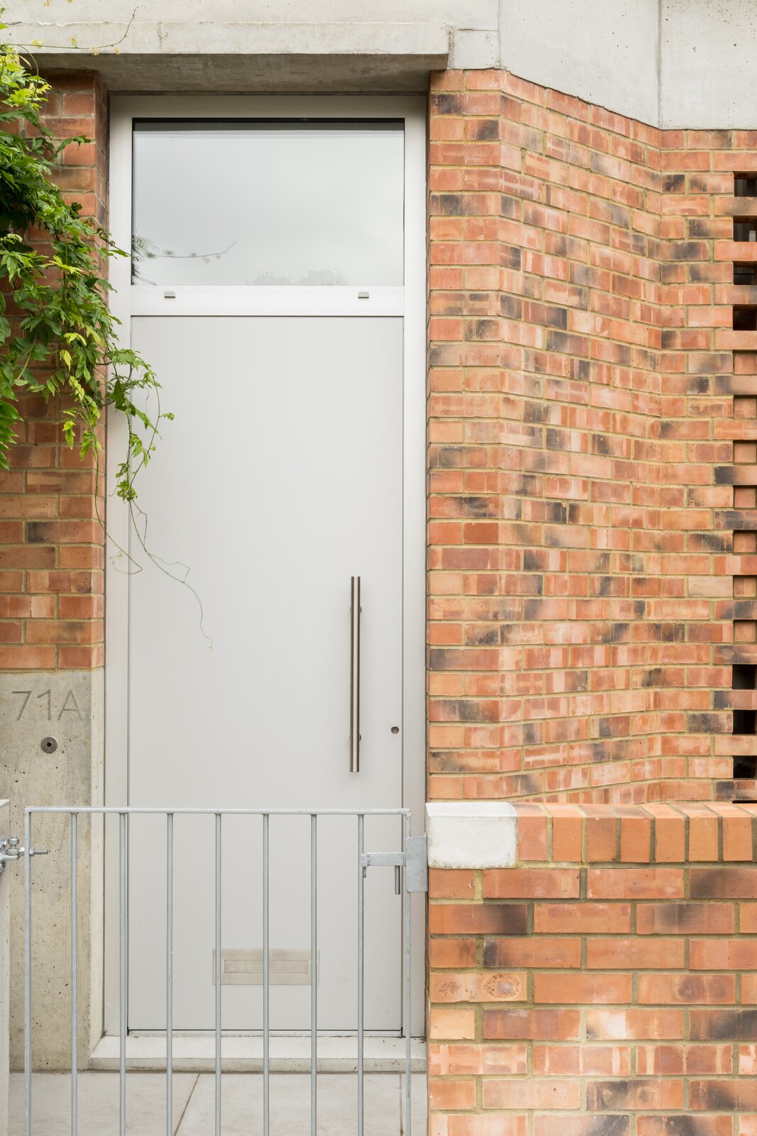 "The hit &amp; miss brickwork on the front elevation lets light into the stairwell but crucially provides screening from passers-by on the street."