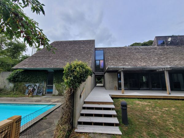 Before: On a two-acre, shorelined property, Forberg designed cedar-clad triangular prisms to sit atop poured concrete bases.