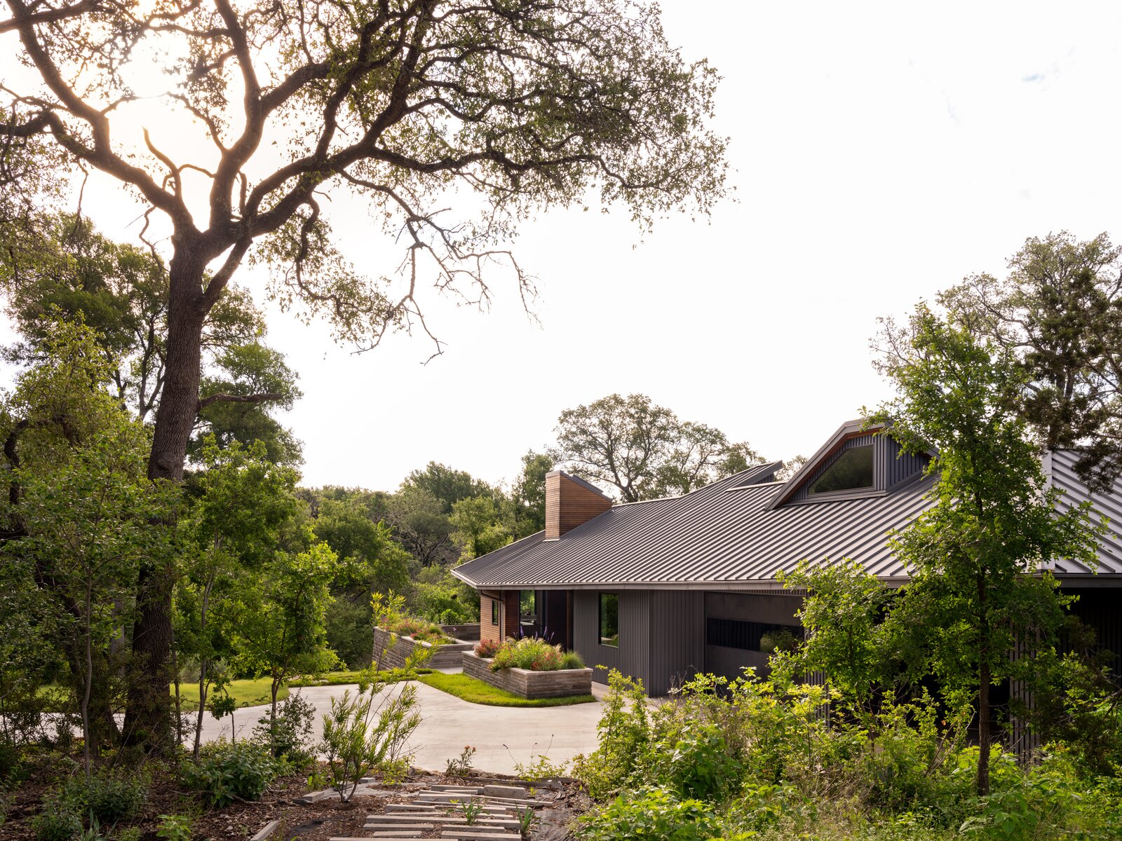 Another money-saving choice was changing the driveway from a stone paver driveway to poured concrete. The roof is designed to collect rainwater, which travels through a set of pipes for storage in a 39,000-gallon cistern behind the house. 
