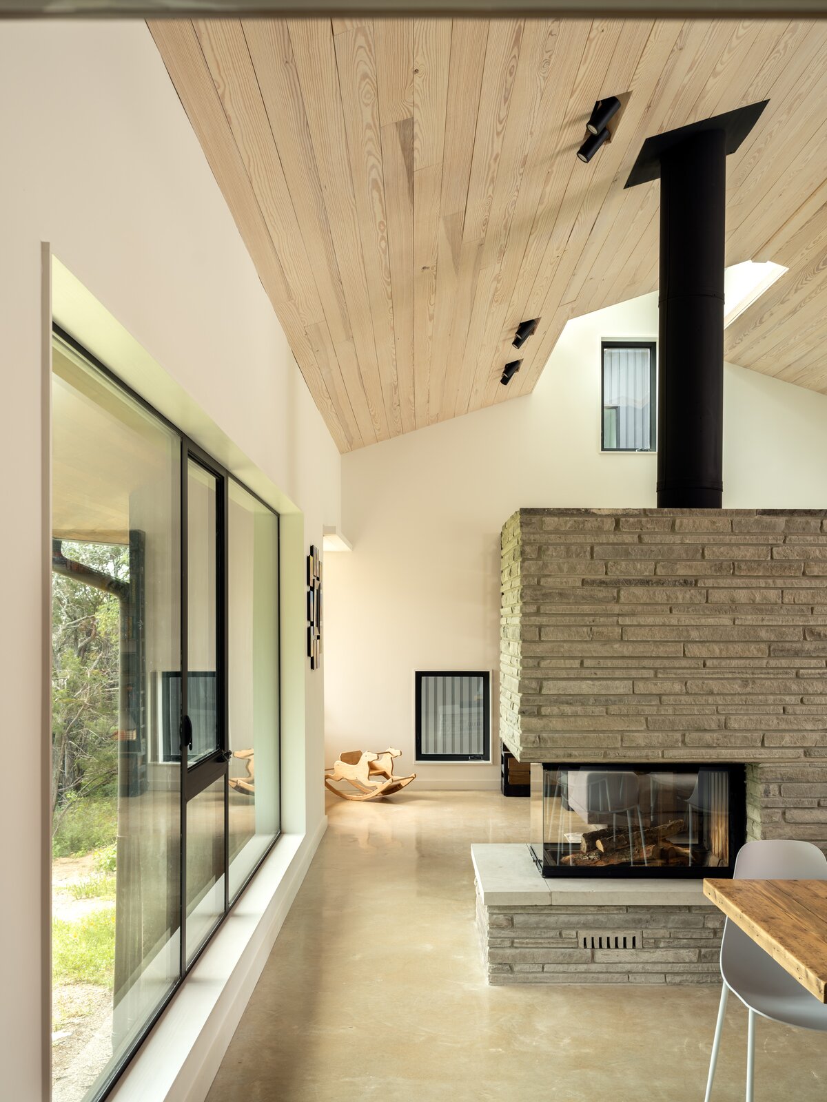 The fireplace is a striking, and popular, feature that the family uses frequently. It was an investment upfront, but will prove a cost-effective choice as time goes on. "Our unit can warm our entire family space including the kitchen, living room, dining room, and office with a more than 90-percent efficiency rating," the homeowner explains. 