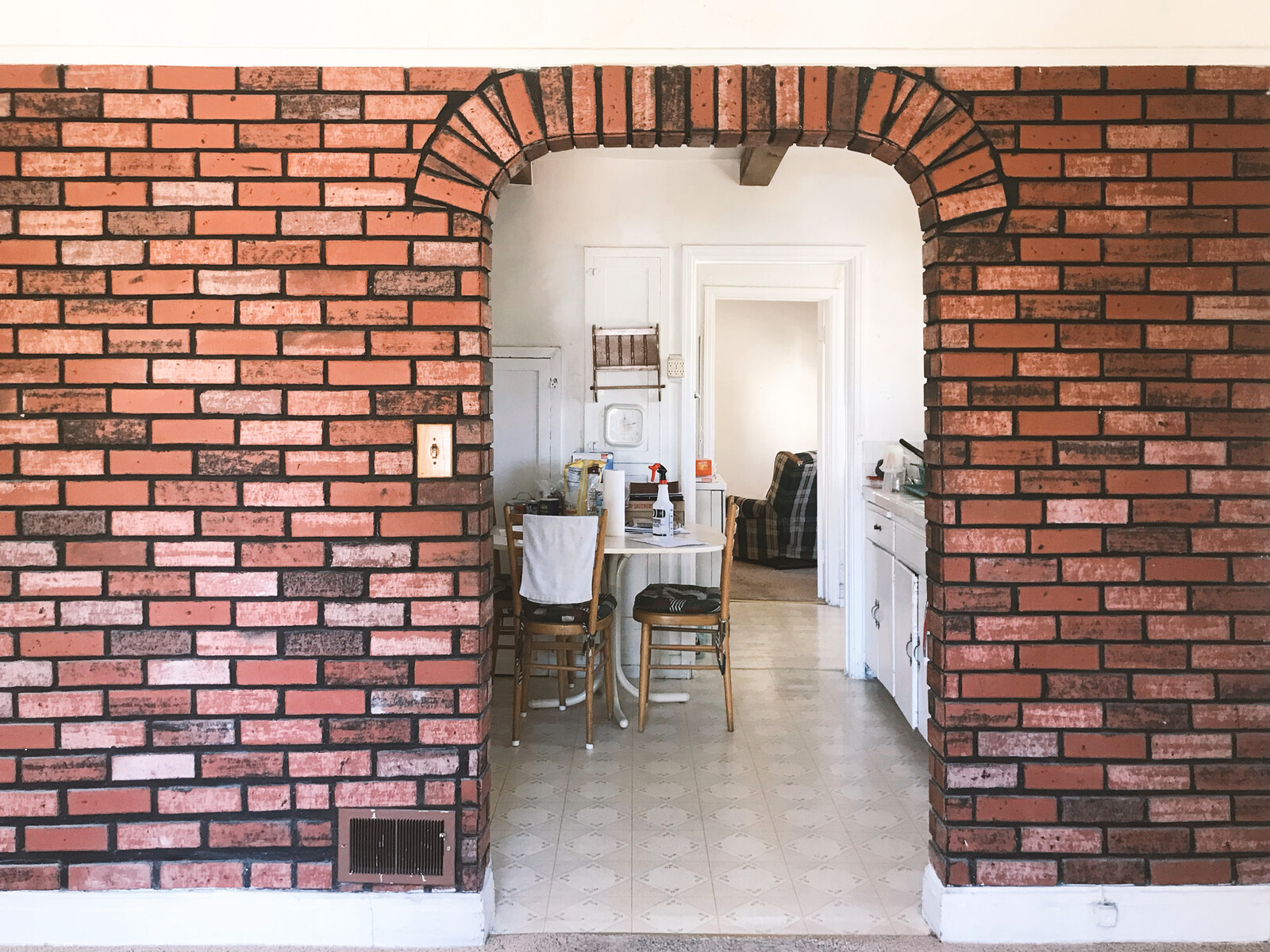 The kitchen was cramped, and the partitions between rooms made the house feel even smaller than it was.
