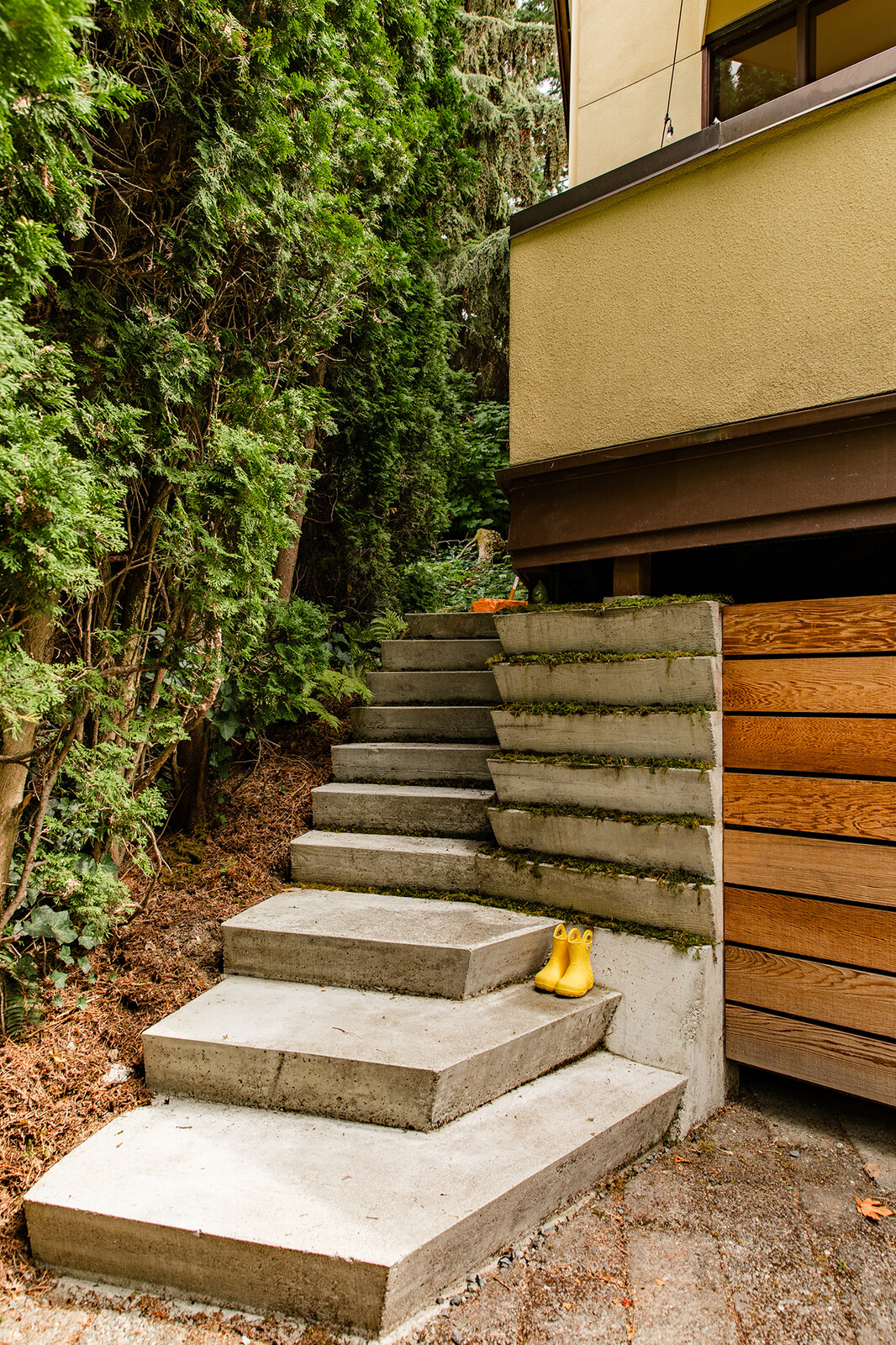 New concrete angled stairs are a nod to Frank Lloyd Wright's design typology (Stricker studied under Wright). 