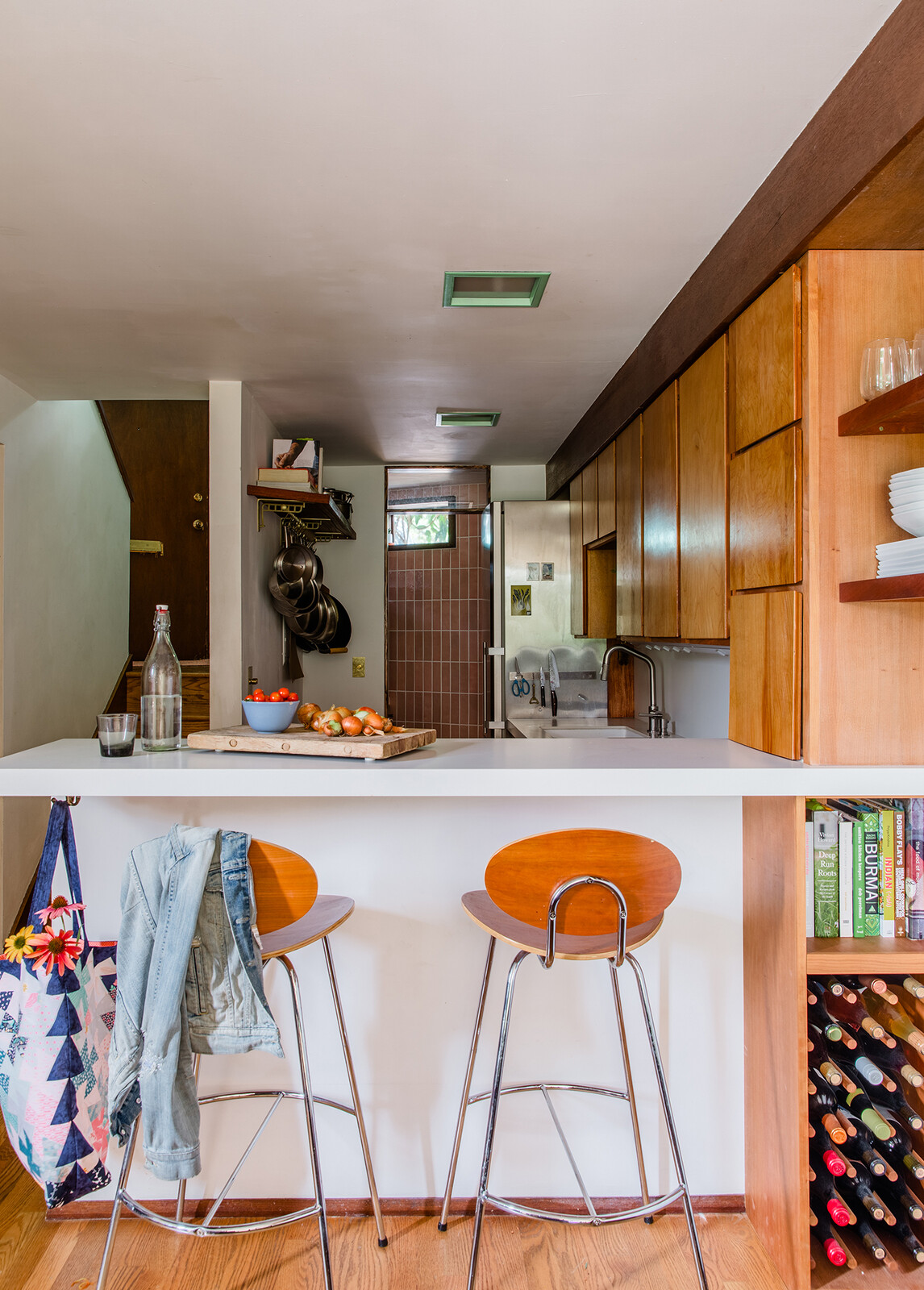 A peek into the butler's pantry reveals vertically oriented pink tile, a choice that Sandy says they could never get a client to bite on. 