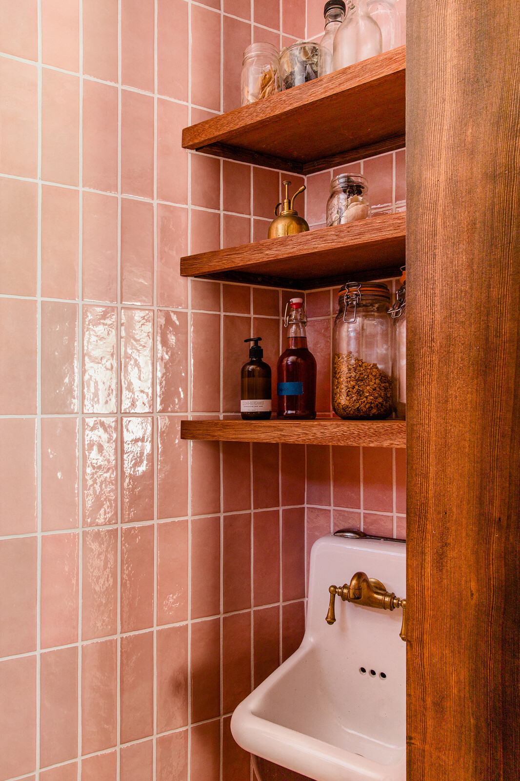 The butler's pantry, which has a tiny utility sink and three rows of shelving, provides just enough extra space off the kitchen. 
