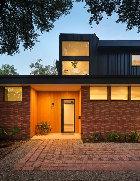 The impactful entryway—made from combed Alaskan Yellow Pine—and the custom front door were a project splurge. Bhavani calls the back addition a 