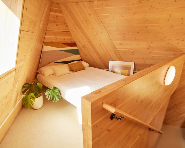 The all-wood interior reflects natural light, making the space feel much larger and more expansive.