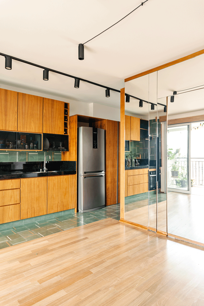 Compact apartment with versatile furniture made from custom carpentry.