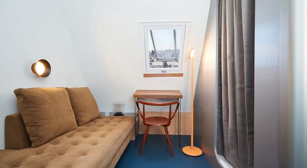 The 107-square-foot apartment is divided into three zones, for sleeping, circulating, and bathing, and prioritizes efficiency "to the centimeter," says its London-based architect Massimo De Conti.