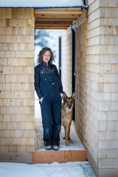 Emily Boschert Cooper and her trusty shepherd dog at home.