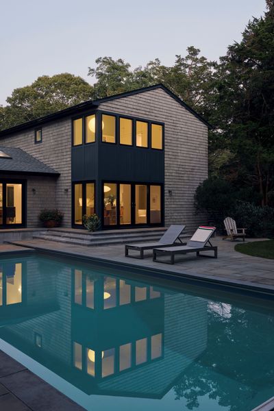 Large Anderson 400 series windows and doors create new indoor-outdoor access to the pool from the living room and dining area.