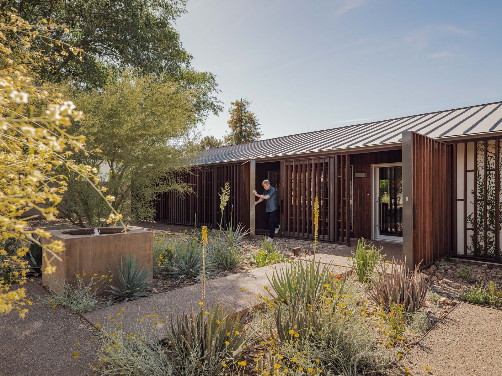 Architect and homeowner Christopher Alt designed the home's pivoting sun shades with Thermory wood slats and FritzJurgens hardware.