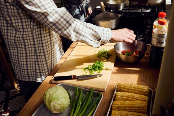 The kitchen didn’t come with a proper countertop, so Serai and Archibald built one next to the stove using an Ikea cabinet and a piece of wood laminate trimmed to size. This counter also cleverly conceals a radiator.