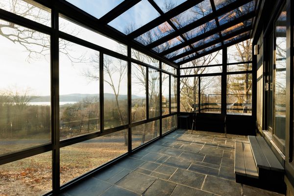 The enclosed sunroom offers an alternative to the patio for colder months.