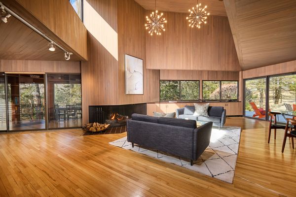 A fireplace warms the living room.