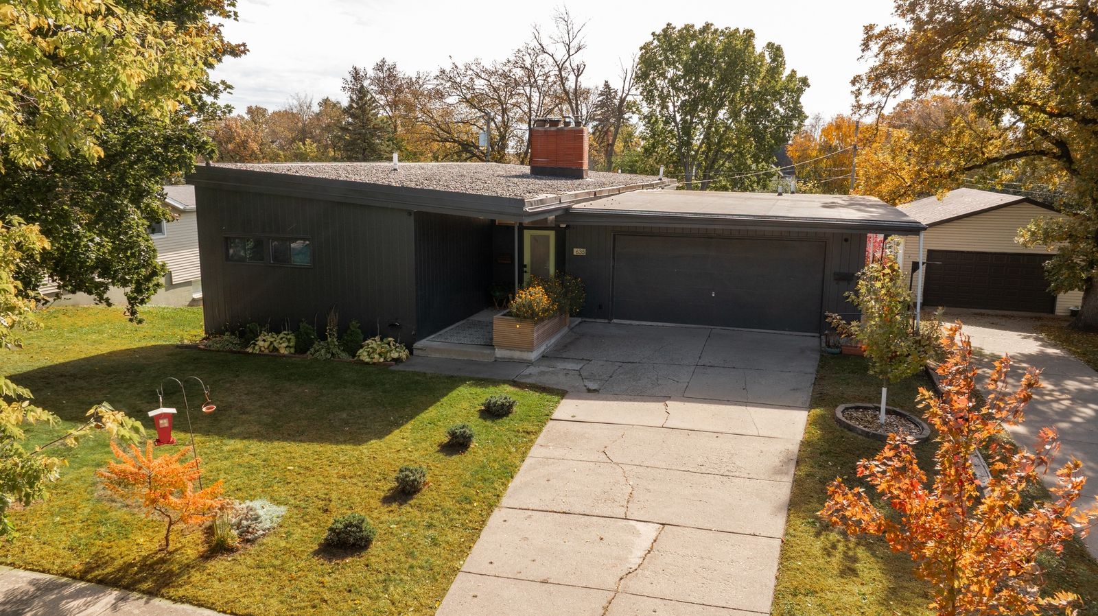 The 1955 home comes with original wood paneling, new built-ins, and a separate unit on the lower level.