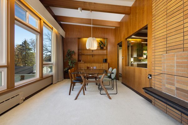 A large south-facing window spans the dining and living room.