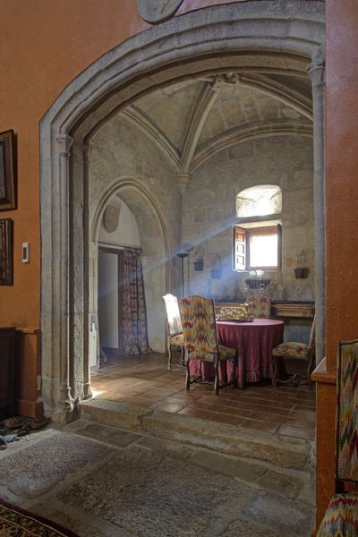 Stone, terracotta, and wood constitute the home's materials.