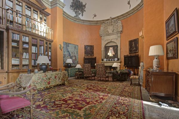 Dual fireplaces help to heat the giant living hall.