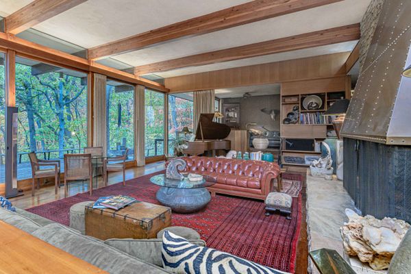 The floor-to-ceiling windows reach 12 feet high, offering a southern exposure and looking out onto the yard.