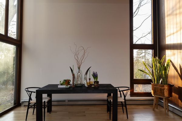 With a lofted second floor, the floor-to-ceiling windows in the living room are double height.