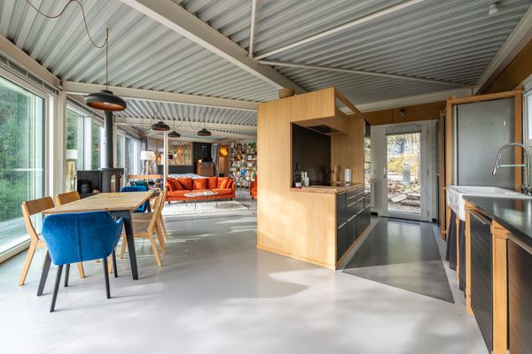 An electric woodstove helps the heat the main room.