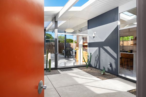 An Eichler staple, the home features an open-air interior courtyard.