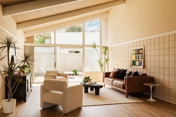 Floor-to-ceiling windows bring natural light into the living areas of the post-and-beam homes.