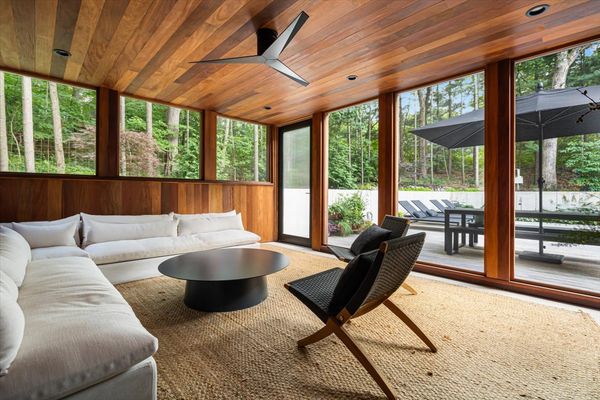 The three-season sun room is paneled with teak.