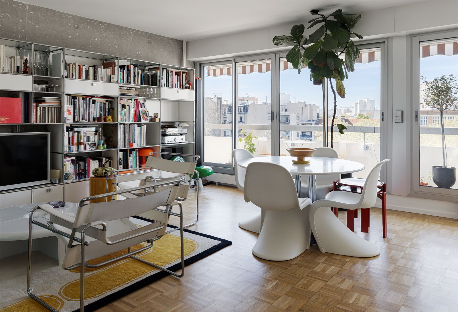 Updated by ALORS Studio, the 19th-arrondissement apartment comes with fresh cabinetry, custom built-ins, parquet flooring, and a full-length balcony.