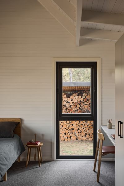 The parents’ bedroom, added during the renovation, is fitted with an Eva timber bed, Step Step stool, Aatos chair, and Linus lounge chair, the parents’ bedroom is functional and deliberately pared-back.