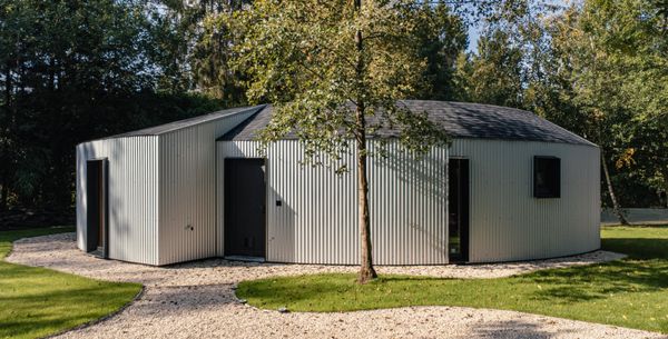 After some dedicatd searching, the couple found a company that could manufacture the corrugated metal siding for a fraction of the price; they spent around $2,400 on it.