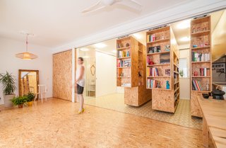 Even though shelves tend to be stationary, Madrid-based PKMN Architectures reenvisioned the possibilities of shelving by creating chipboard units that slide along a track to expose various types of shelving that support a fold-out bed, a work space, and other practical uses when separated. When compacted together, the three units act as a more traditional set of shelves, displaying books and other items.