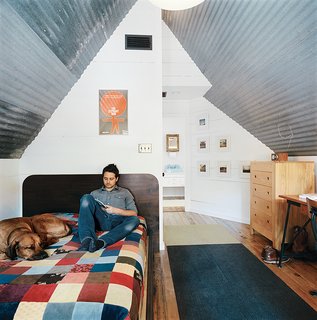The bedroom takes up the small second floor of the house.