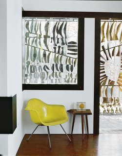 Wooten asked Massie to incorporate a 1960s steel screen by Don Drumm into the house; Massie placed it on a central pivot so it acts as a gate, a privacy barrier, and an architectural gesture. "We actually changed the whole roofline of the porch to accommodate the screen being able to pivot," says Massie. "The screen also allowed the building to have an immediate history." dondrummstudios.com
